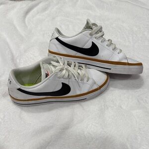 Nike White and Black Sneakers with Gold Accents